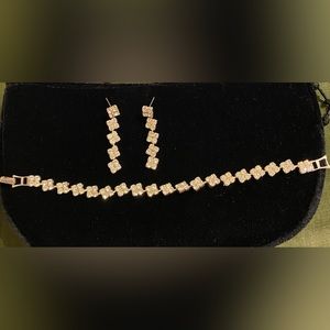 Set of rhinestone earrings and bracelet on silver tone. Excellent condition.